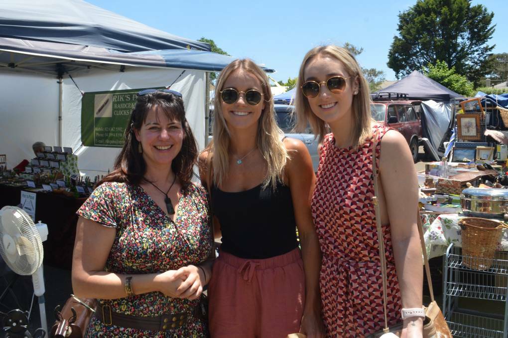 CHRISTMAS SHOPPING: Tess Stevens and Charlotte and Bridget Jasprizza checked out the wares at last year's market. 