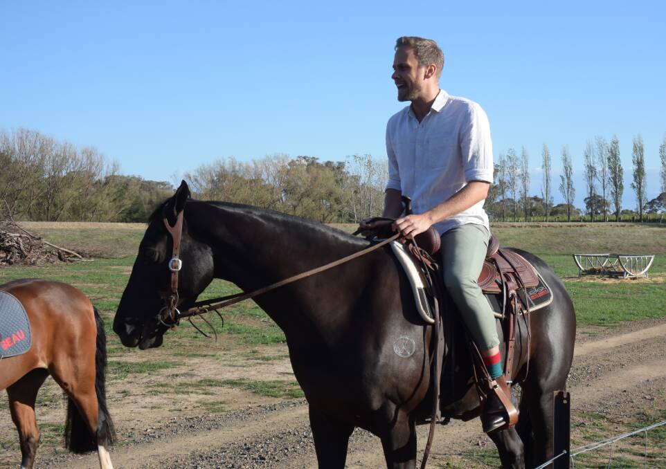 ON THE JOB: Tim Davies on Australian stockhorse filly Rici. 