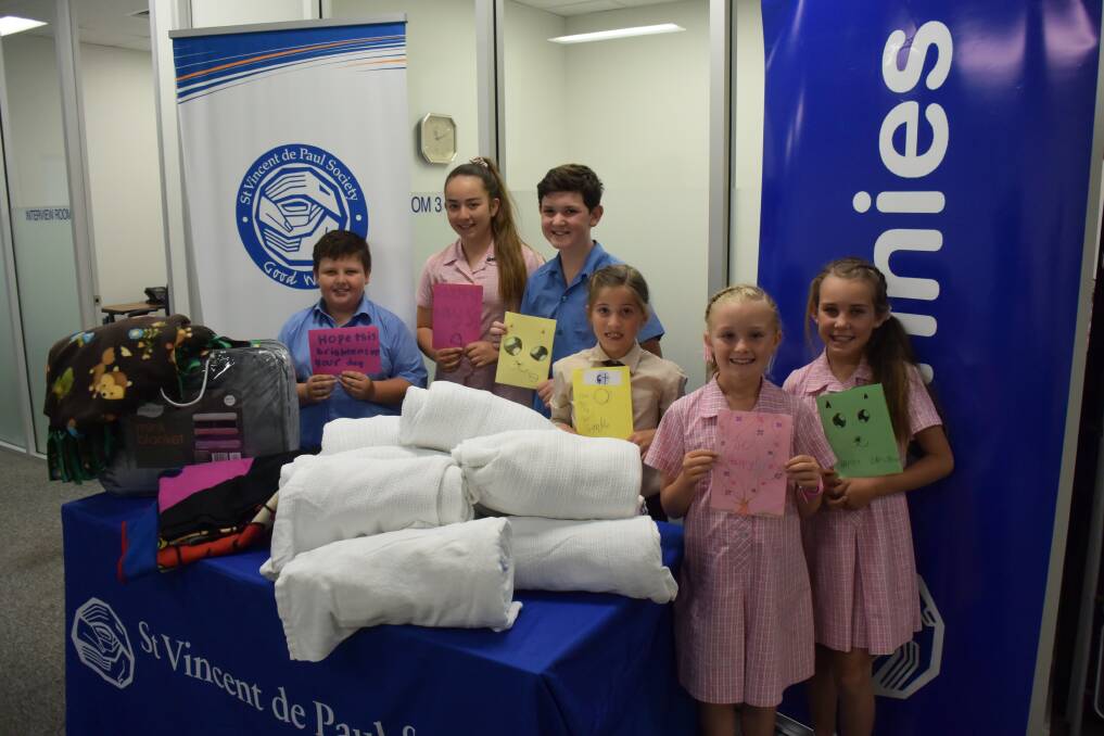 DONATION: St Mary's Catholic Primary School students Andy Gerber, Millie Banks, Alexander Bayada-Harvey, Maddy Pulbrook, Jade Haynes and Bianca Lindfield. 