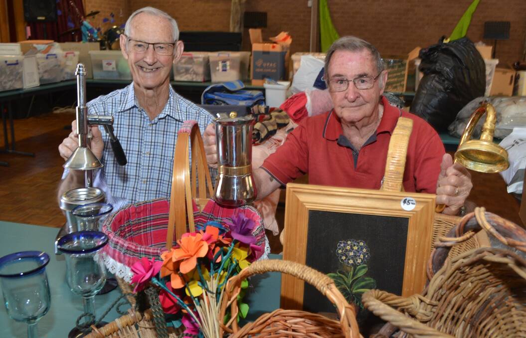 FOR SALE: Garage sale convener Col Westcott and Orange Uniting Church property committee chairman Ray Manchester with some of the salvaged items on offer this Saturday. 