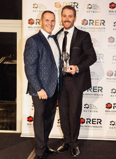 BRINGING SILVER HOME: RER's Michael Sheargold with McCormack Barber Real Estate's Peter McCormack with the award. Photo: SUPPLIED