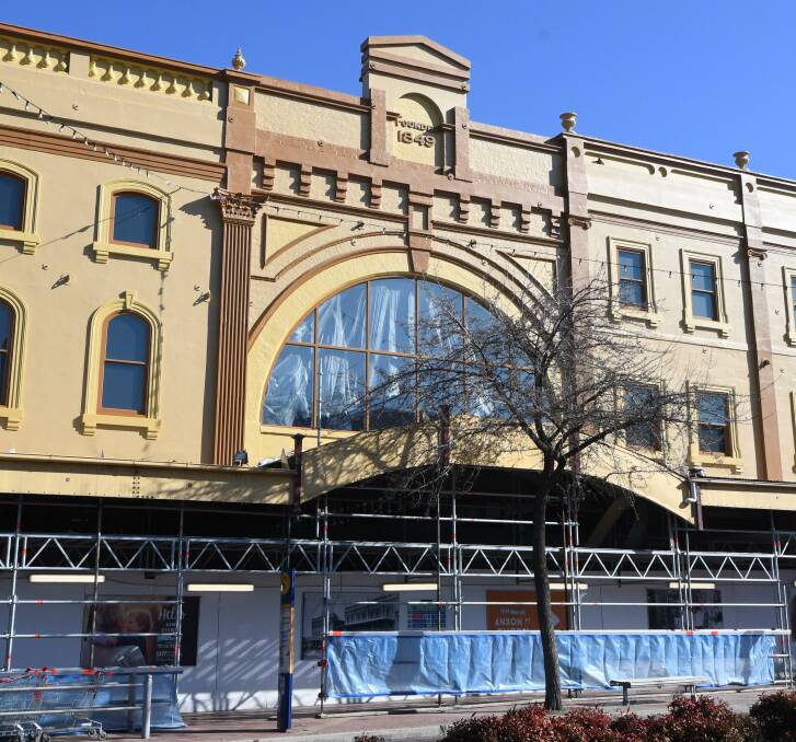 IN PROGRESS: Renovations continue on the Dalton Brothers building facade, with the restored central window already visible, as well as the rooftop urns. Photo: JUDE KEOGH