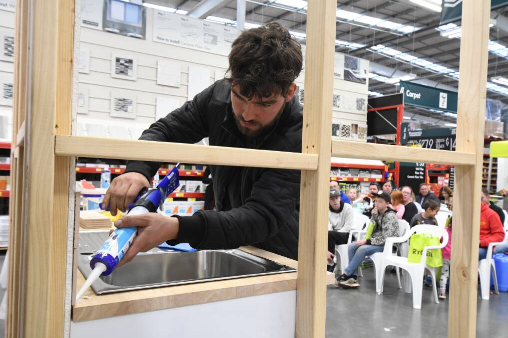 CONCENTRATION: Mat Cassim demonstrates his skills with a silicone gun. 