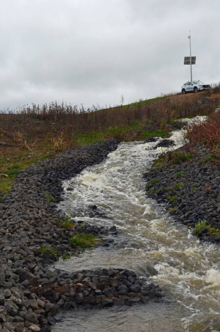 WELCOME SIGHT: Water flows from the end of the Macquarie River pipeline into Suma Park Dam. Photo: SUPPLIED