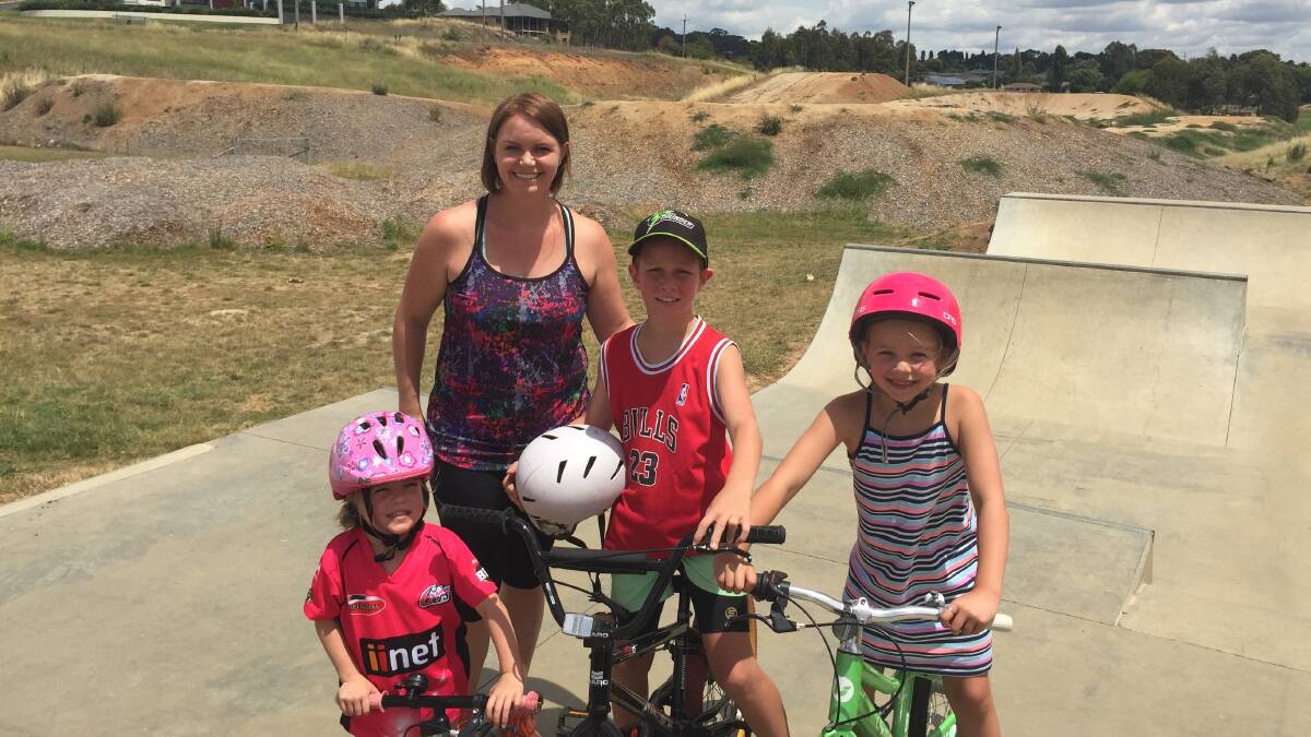 REGULAR VISITORS: Heidi Gardiner with her three children Layla, Bailey and April at the Anzac Park skate park, in front of the BMX facility, still under construction. Photo: DANIELLE CETINSKI 1228dcbmx1