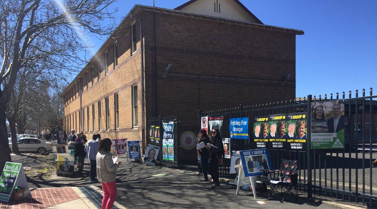 IN PLAIN SIGHT: The Shooters, Fishers and Farmers posters were prominent outside Orange Public School on Saturday. Photo: JUDE KEOGH