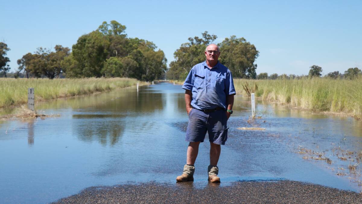 Bedgerabong farmer Scott Darcy woke up to the first of the Lachlan River floodwaters coming across Noakes Road on Thursday morning, and is preparing his property for the arrival of the water.