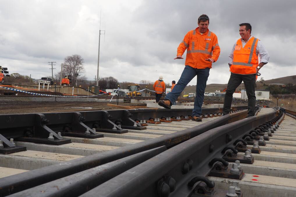ON TRACK: Tim Halloran from John Holland Rail and Member for Bathurst Paul Toole at Georges Plains, where a new rail loop is starting to take shape.