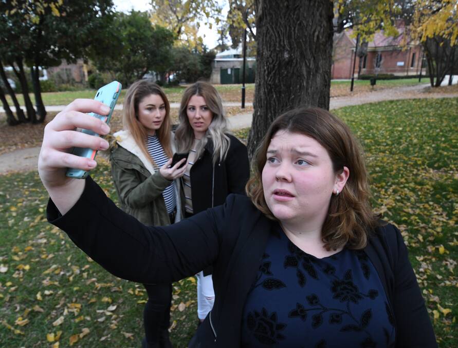 MESSAGE: Rebekka Manns (front), Taylah Evans and Gabrielle Allen have a show about self image that they have been taking to rural high schools. Photo: CHRIS SEABROOK