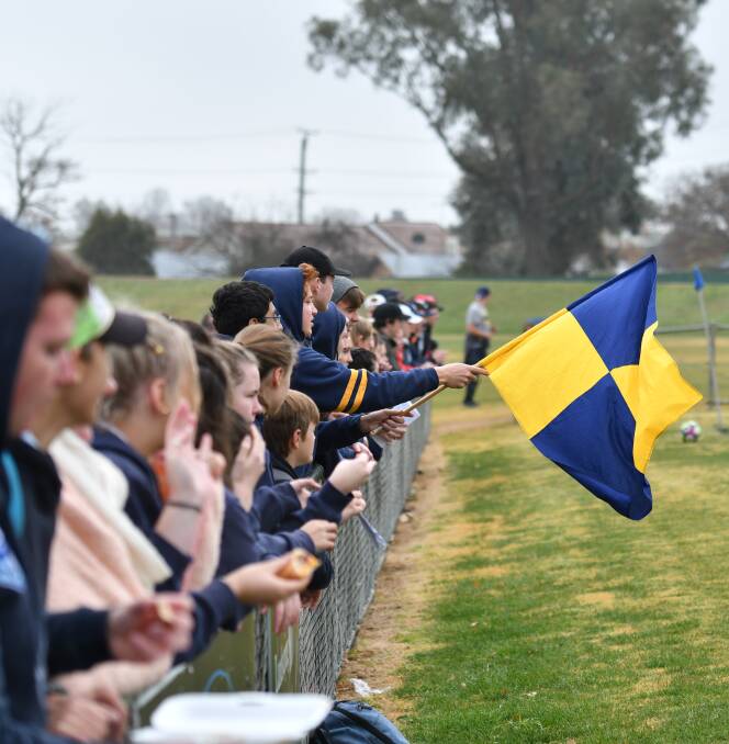 BIG WAVE: Bathurst High supporters show their spirit during the opening day of Bathurst's tie against Orange High on Thursday. Photo: ALEXANDER GRANT