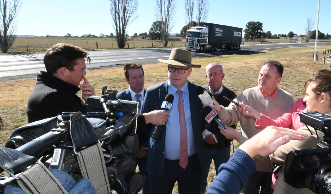 ON THE ROAD: Transport for NSW western regional director Alistair Lunn addresses the media at Raglan in July. Also pictured are Bathurst MP Paul Toole and deputy mayor Bobby Bourke. Photo: CHRIS SEABROOK 072319cupgrade2