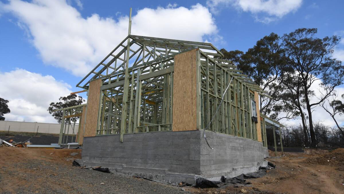 UNFINISHED: Despite the owner spending at least $370,000 this house has only a slab and frame. Photo: JUDE KEOGH