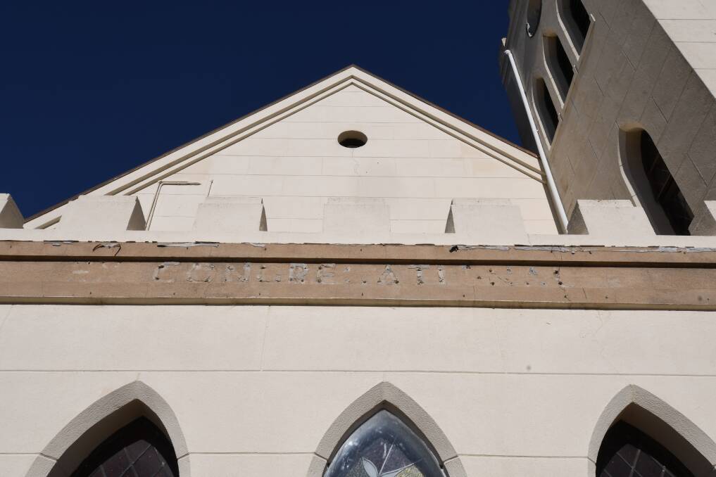 MISSING: The letters were removed from the front of the church. Photo: CARLA FREEDMAN
