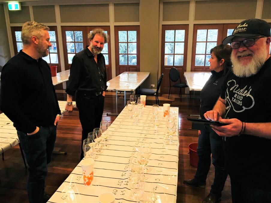 GOOD DROP: Wine judges Nick Spencer, Jeremy Dineen and Fiona Donald with the Chair of Judges Dave Brookes during the awards' tasting process. Photo: Supplied
