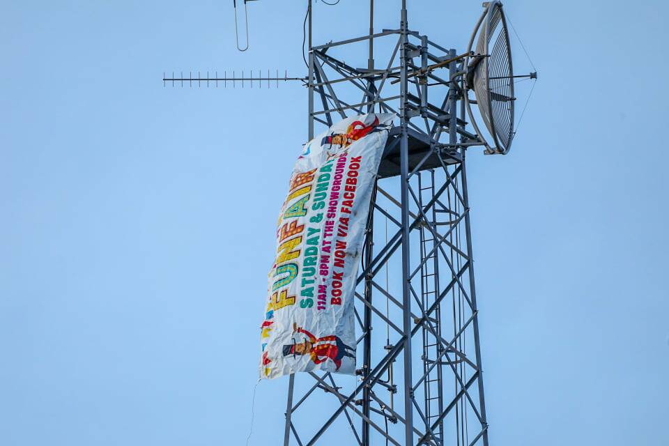 FLYING HIGH: The banner on top of the Orange telecommunications tower on Wednesday. Photo: TROY PEARSON/TNV