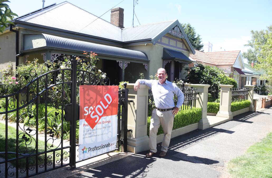 DEAL: Professionals Orange estate agent Alistair Miller at a Clinton Street home sold by agency director Pat Cutcliffe. Photo: CARLA FREEDMAN