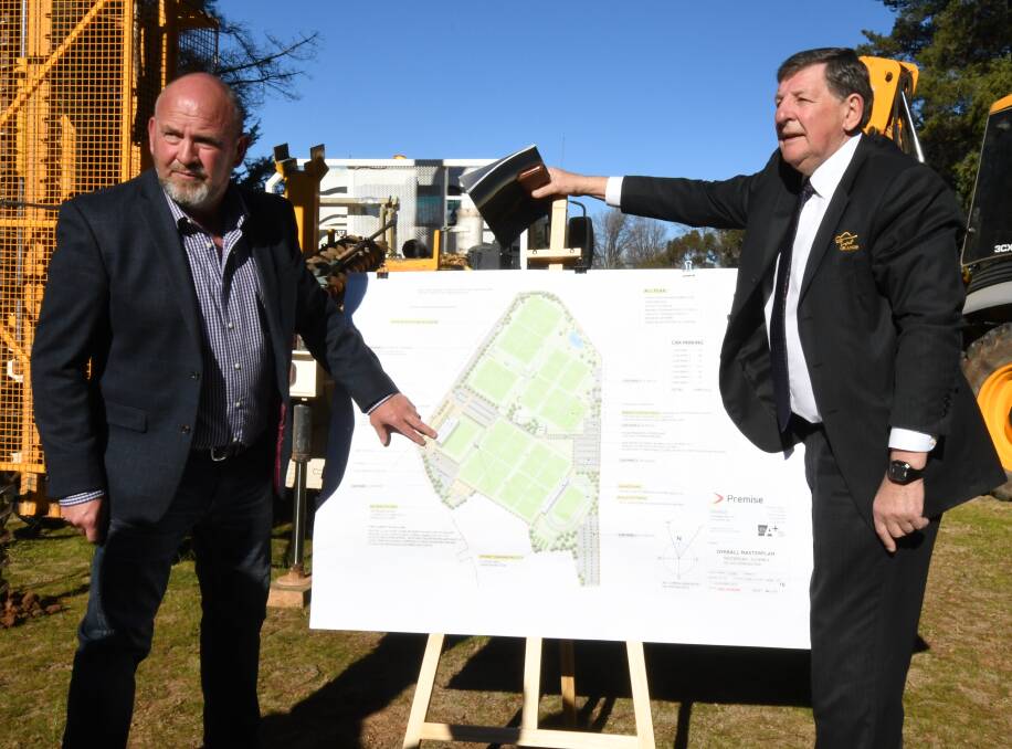 DESIGN: Councillors Jason Hamling and Reg Kidd show off plans for the sporting precinct to be built in the next three years. Photo: JUDE KEOGH