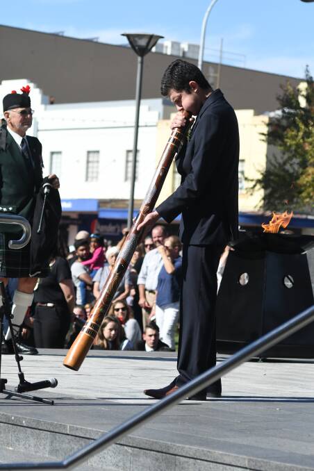 2018: Lynton Robbins performs at the Orange Anzac Day service in Robertson Park. Photo: JUDE KEOGH