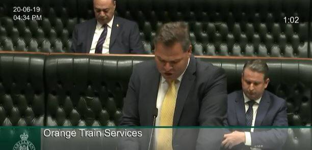 LOCAL MEMBER: Phil Donato speaks to State Parliament on the rail petition.