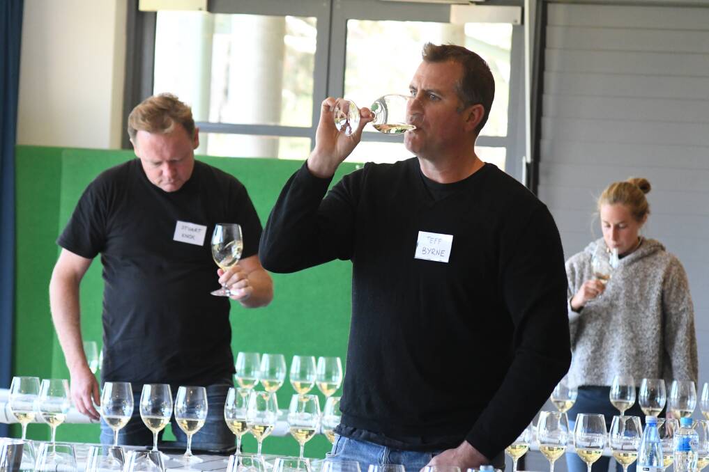 PLENTY MORE TO TRY: Jeff Byrne and other judges taste the whites during the first day of Orange Wine Show judging. Photo: JUDE KEOGH 