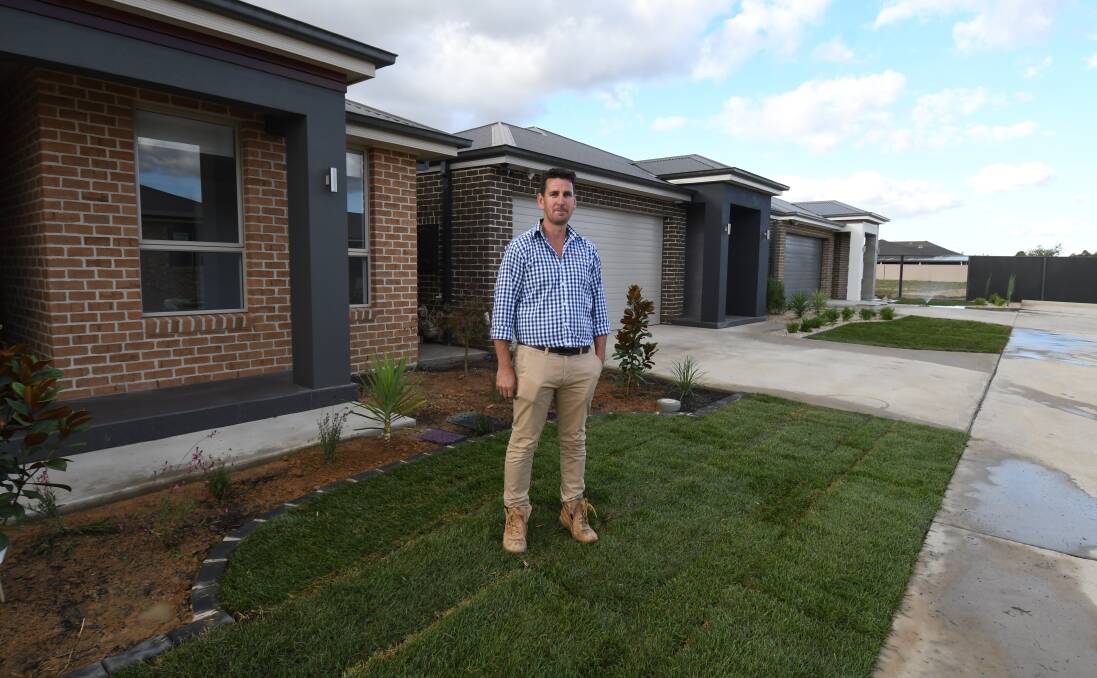READY TO GO: Contemporary Homes owner-director Michael Paddison at the new estate. Photo: JUDE KEOGH 0411jkgates2