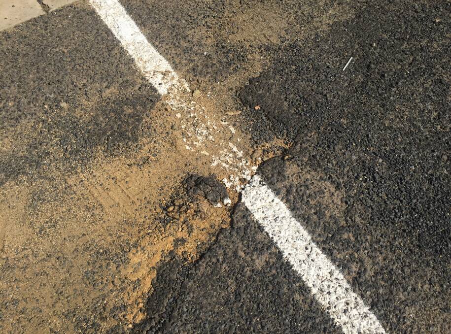 WHITE LINE: Paint in a pothole in the council car park.