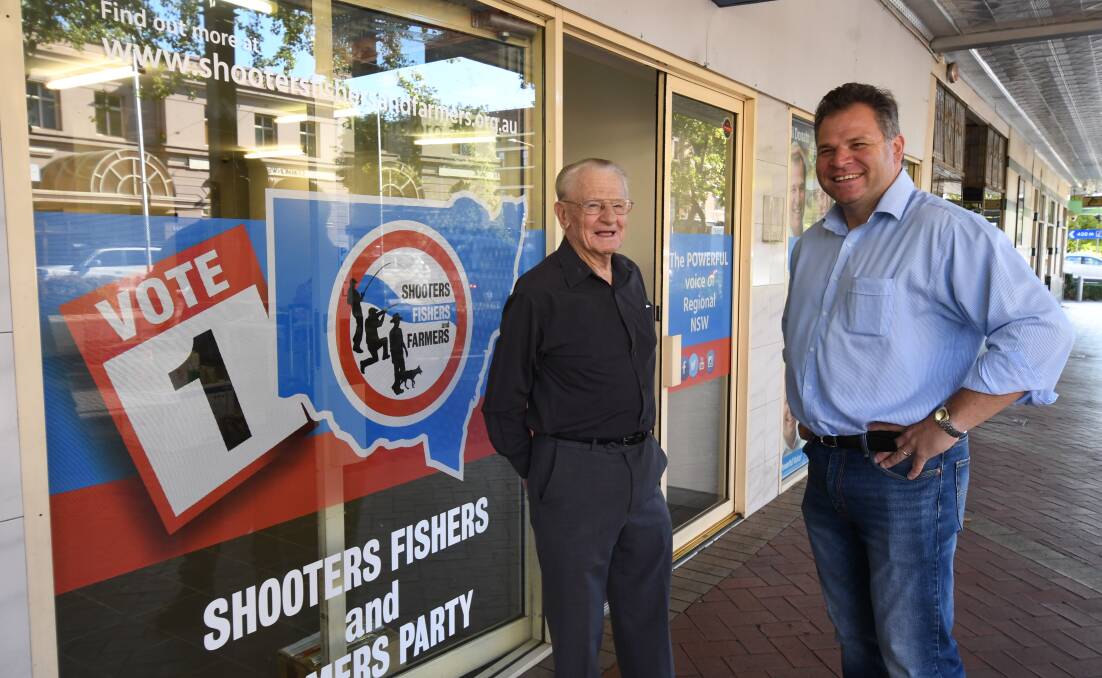 CAMPAIGN HQ: Voter Neville Plant with Phil Donato outside the just-opened Shooters Fishers and Farmers Party election office in Summer Street on Thursday. Photo: JUDE KEOGH 0221dfdonato2