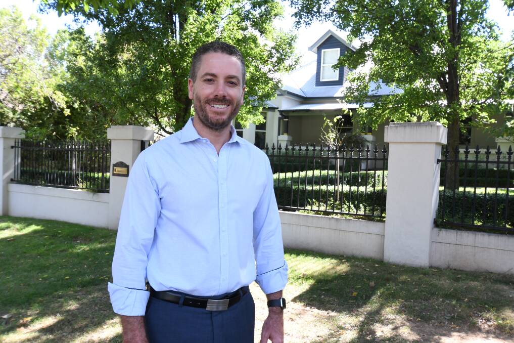 FORECAST: Real estate agent Peter McCormack outside a Clinton Street property his agency has for sale for $1.39 million. It is one of about three homes in the CBD currently for sale for more than $1 million. Photo: JUDE KEOGH 0221jkmccormack3 