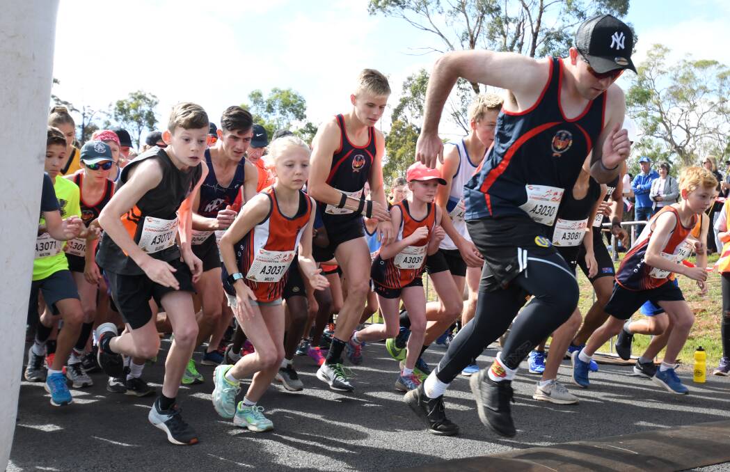 START LINE: Hugh Daintith (3030) leads the 700-strong pack of runners away in the five kilometre event. Photo: CARLA FREEDMAN