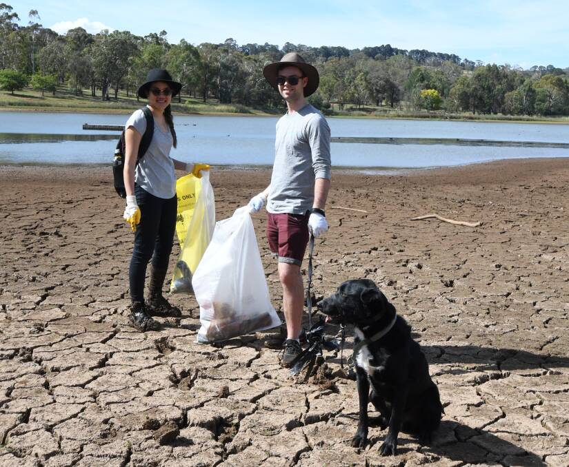 DRYING UP: Angelique Lu, Donal Sheil and Django clean up at the lake.