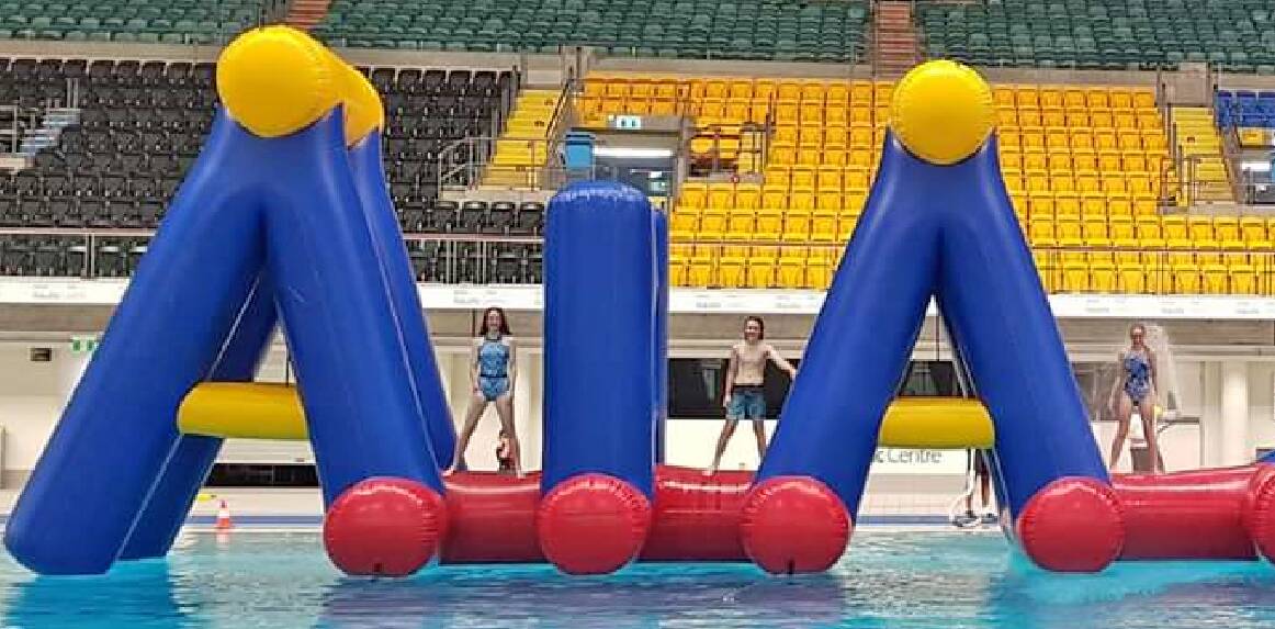 WET AND WILD: The Crazy Race inflatable coming to the Orange Aquatic Centre in mid-late January is of a similar scale to this inflatable at the Sydney Olympic Aquatic Centre at Homebush. Photo: Supplied