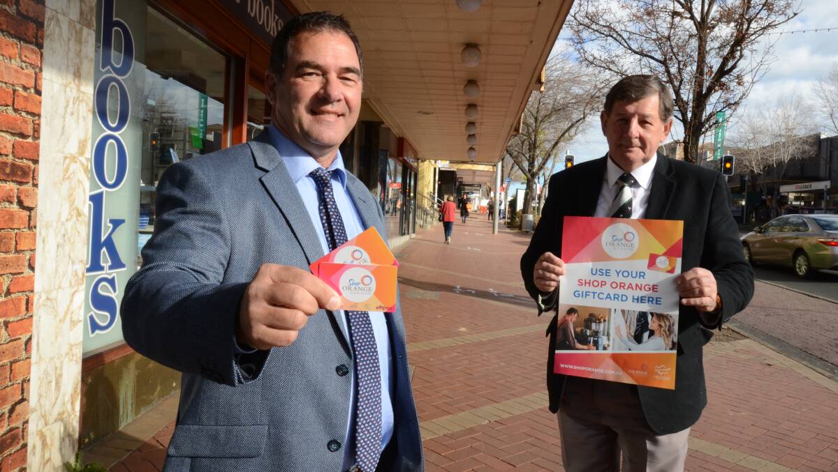 WIN A PRIZE: Cr Tony Mileto and mayor Cr Reg Kidd are encouraging people to enter the draw to win gift cards. Photo: JUDE KEOGH