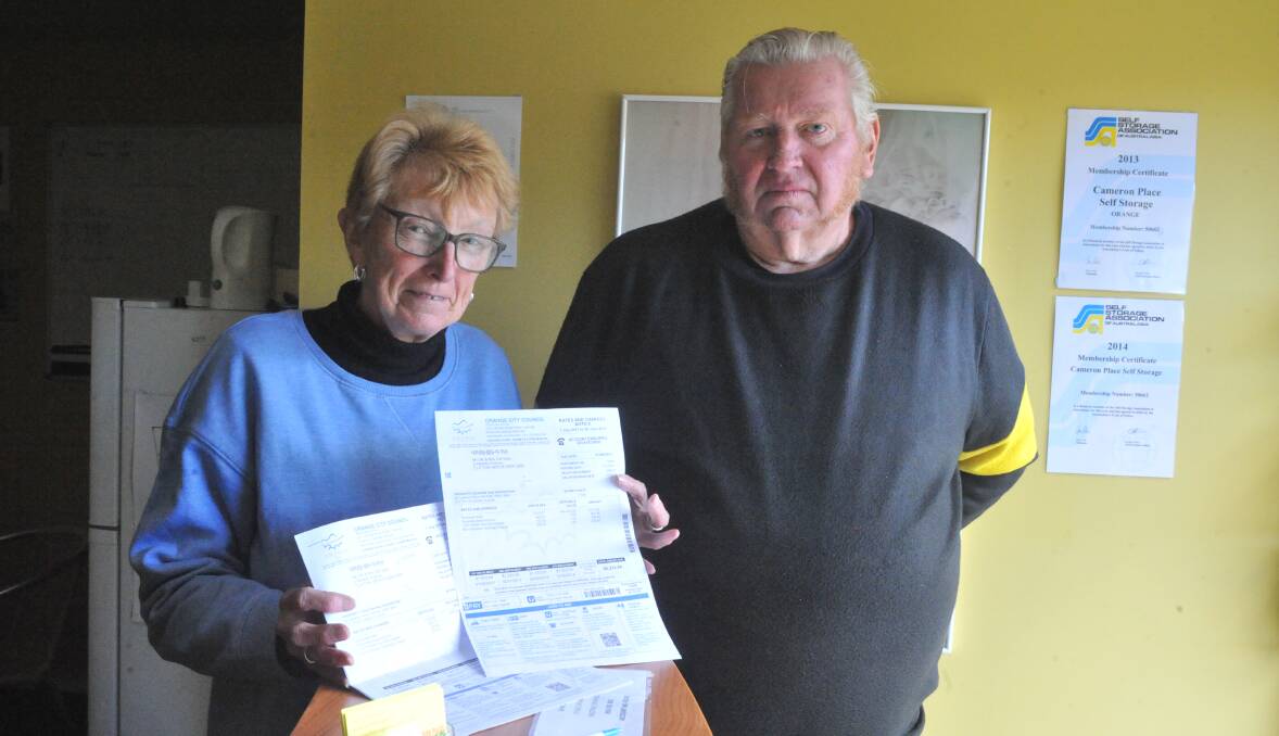 VALUE ADDED: Chris and Dave Gray with their rates notices for their self-storage business. Photo: JUDE KEOGH 0818jkrates8