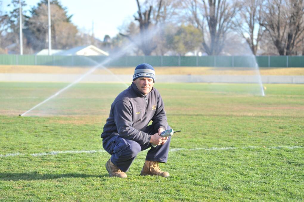 JUNE 2017: Wade Park curator Bruce Cousins with the sprinklers going in the drought. Photo: JUDE KEOGH