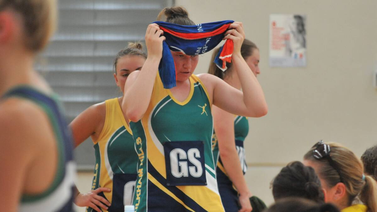 TOO HOT: Playing sport was tough in Orange in Saturday's heat as Baulkham Hills' netballer Emily Mitchell found. Photo: JUDE KEOGH