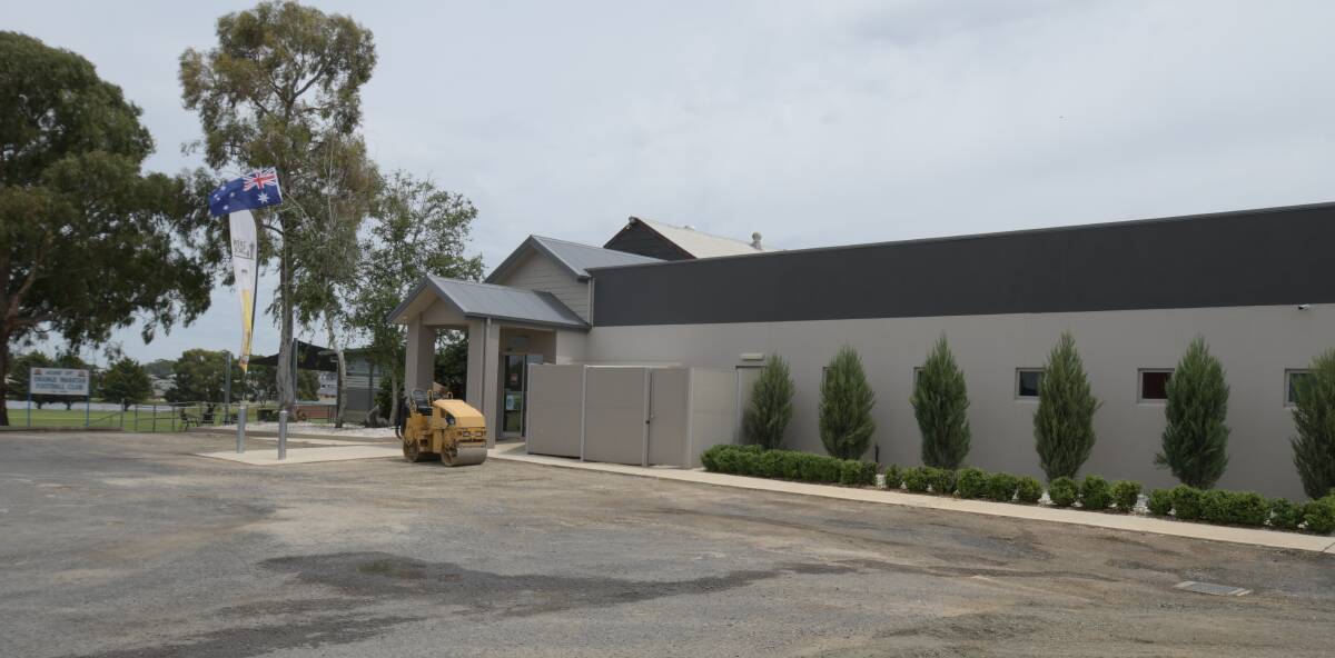 WORK: The car park at the Waratah Sports Club is being re-sealed with club money. Photo: JUDE KEOGH