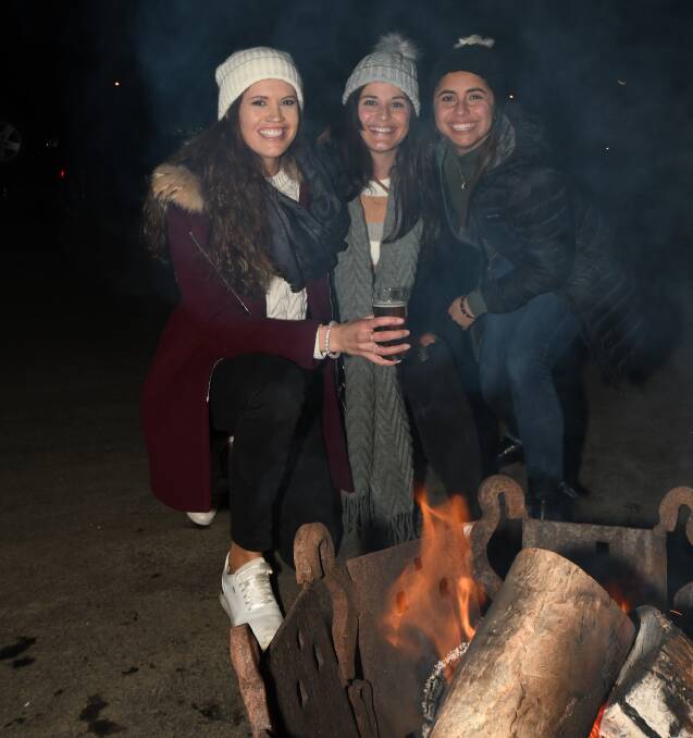 ALL FIRED UP: Cheynee Burke, Bianca Pelliccia and Morena Fuentes enjoy the festival fun at the Agrestic Grocer on Saturday. Photo: CARLA FREEDMAN