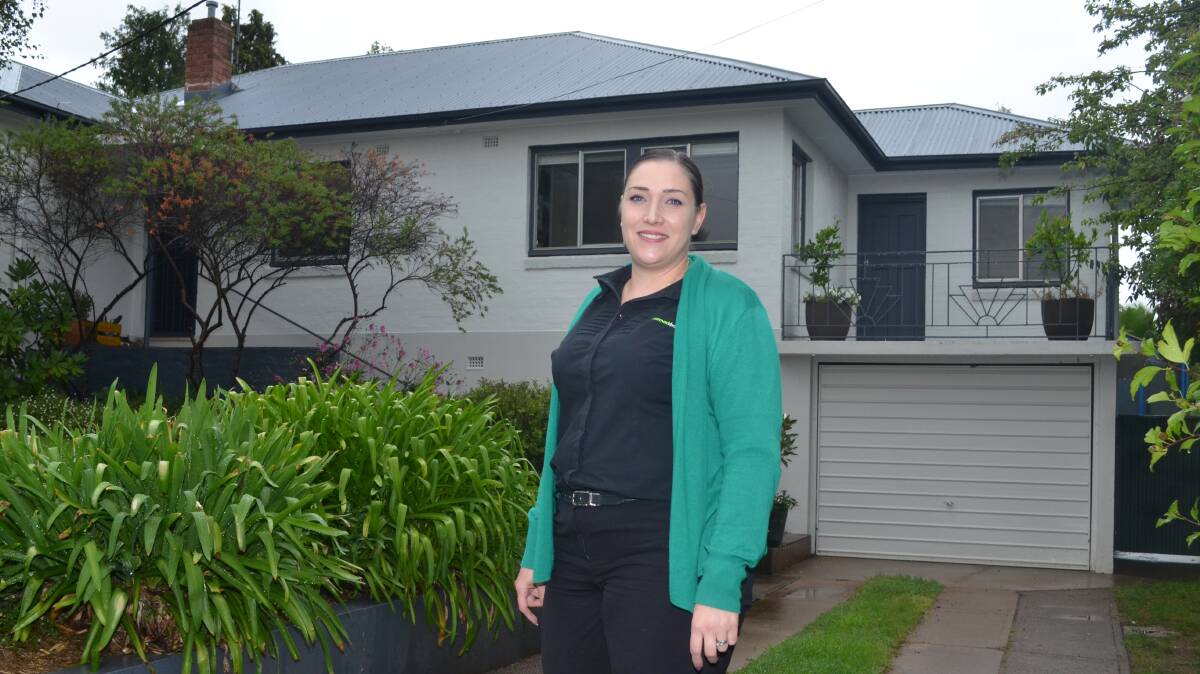IN DEMAND: McCormack Barber Real Estate property manager Erin Marr outside 86 Franklin Road which had five people keen to rent the house. Photo: DAVID FITZSIMONS