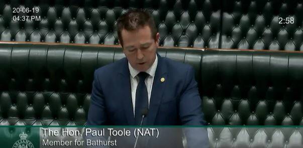 NON-COMMITTAL: Regional Transport Minister Paul Toole replies in Parliament.