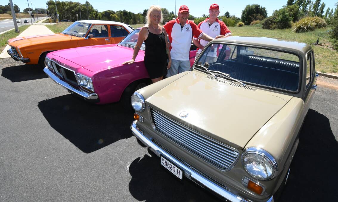 RARING TO GO: Debbie Robinson, Steve Tobin and Robert Gazzard with their classic cars ahead of Saturday's Gnoo Blas show. Photo: JUDE KEOGH 0213jkgnoo3