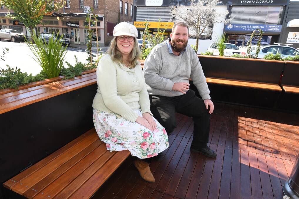 ON THE STREET: Sarah Blake and Nic Drage enjoy the new dining booth on Lords Place which was opened for people to use on Thursday. Photo: JUDE KEOGH