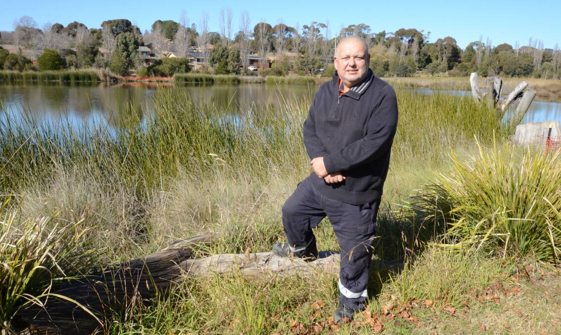 FISHING RULES RELAXED: Cr Mario Previtera at the Ploughmans Wetlands where fishing will no longer be banned. Photo: JUDE KEOGH