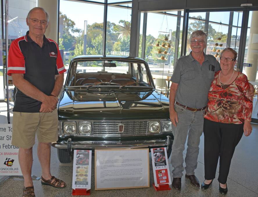 PROUD: Car club member Greg Harvey with Fiat fans Anthony Suttor and Jennie Eade and their 1968 Fiat.