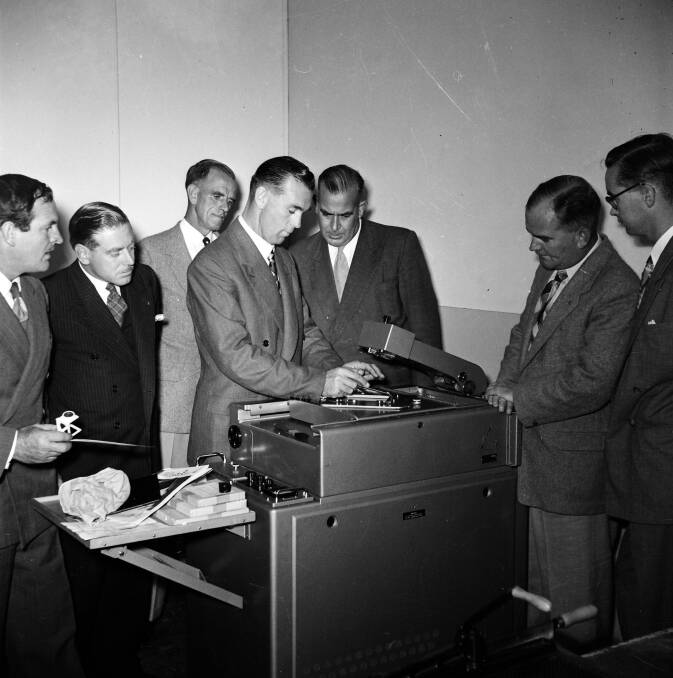1955: Doug McGregor, mayor Ernest White, editor John Farland, P Permewan, Alan Ridley, A Case and G Harrison test the CWD's new Klischograph picture machine.