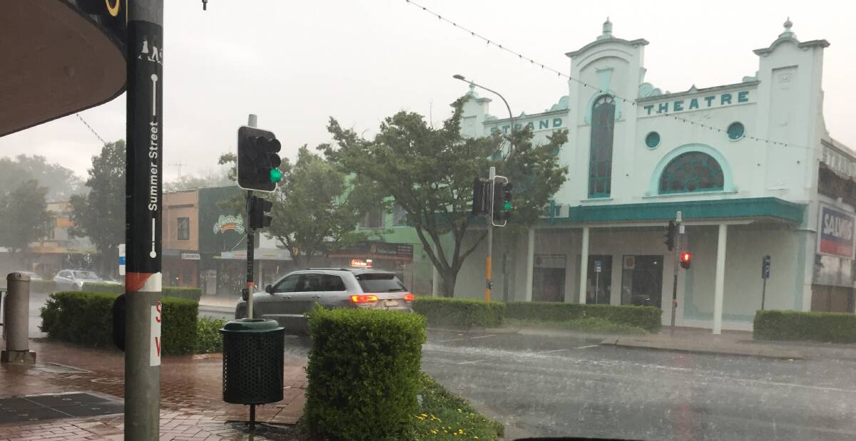 STORM: Heavy rain falls in Summer Street on Monday afternoon.