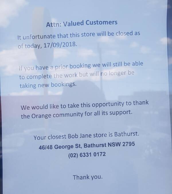 VALUED CUSTOMERS: A note in the window of the Peisley Street store.