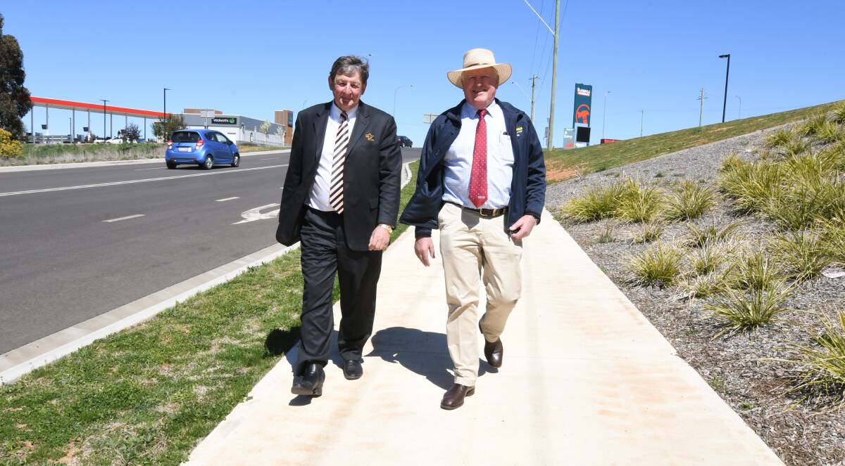 CATCH THE BUS: Orange mayor Reg Kidd and western NSW parliamentary secretary Rick Colless near the site of a new bus stop in Leeds Parade. Photo: JUDE KEOGH 0921jkshelter4