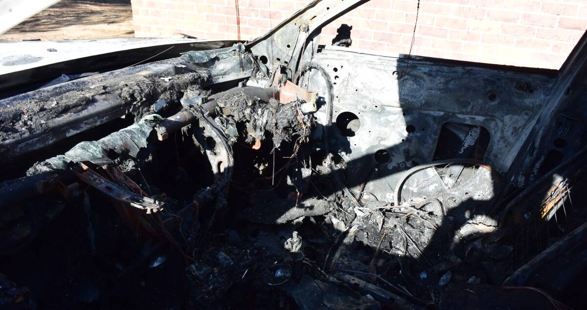 BURNT OUT: The remains of the fire damaged interior of the Audi.