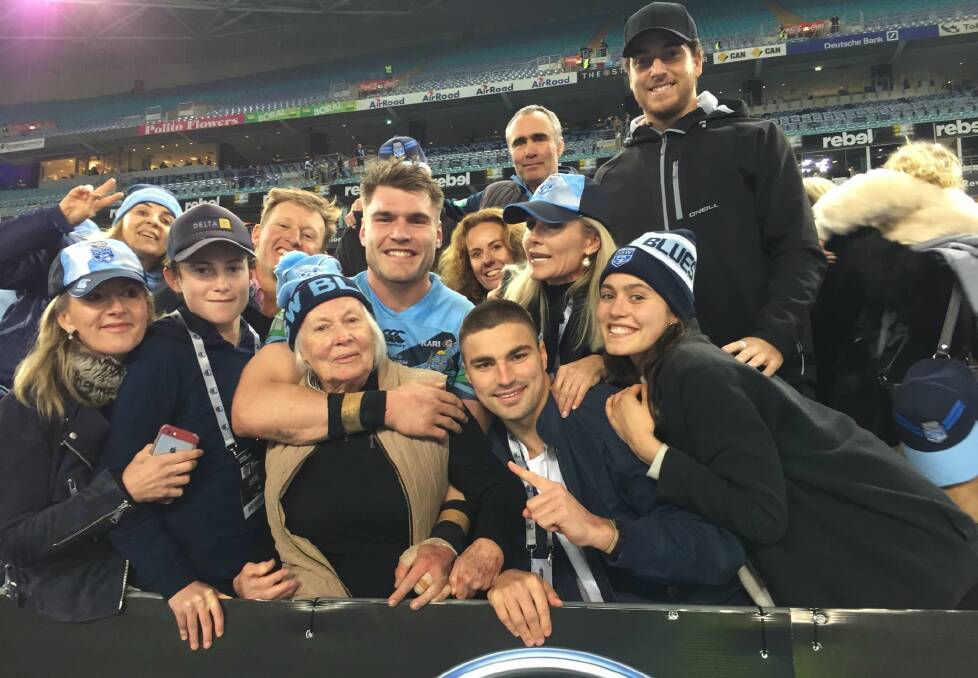 Images of Angus Crichton's family at the State of Origin game