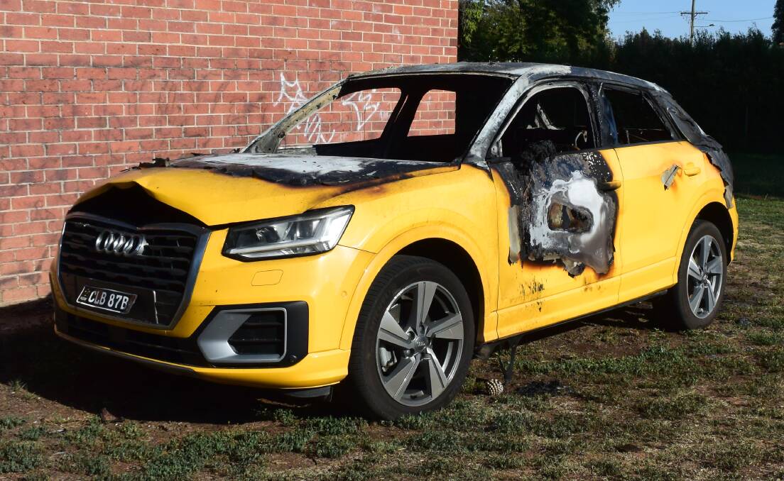 EXPENSIVE: This yellow Audi, burnt out in Newman Park in January, has been one of the victims of the spate of car fires.